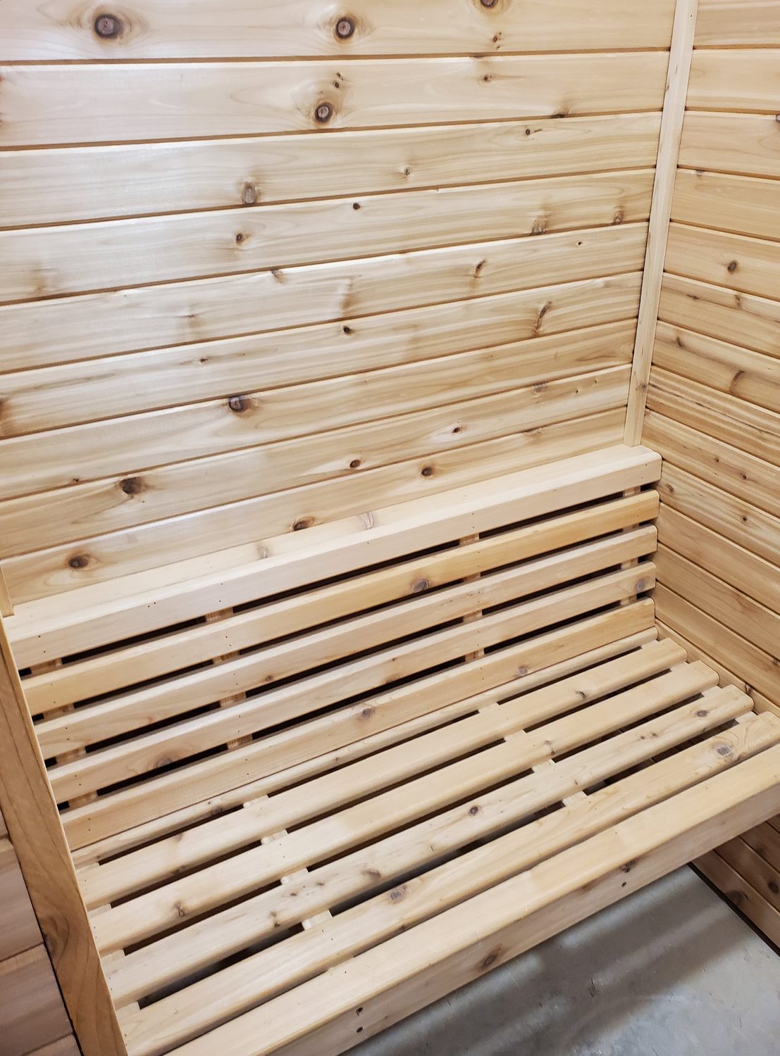 Custom cedar sauna interior with slatted benches
